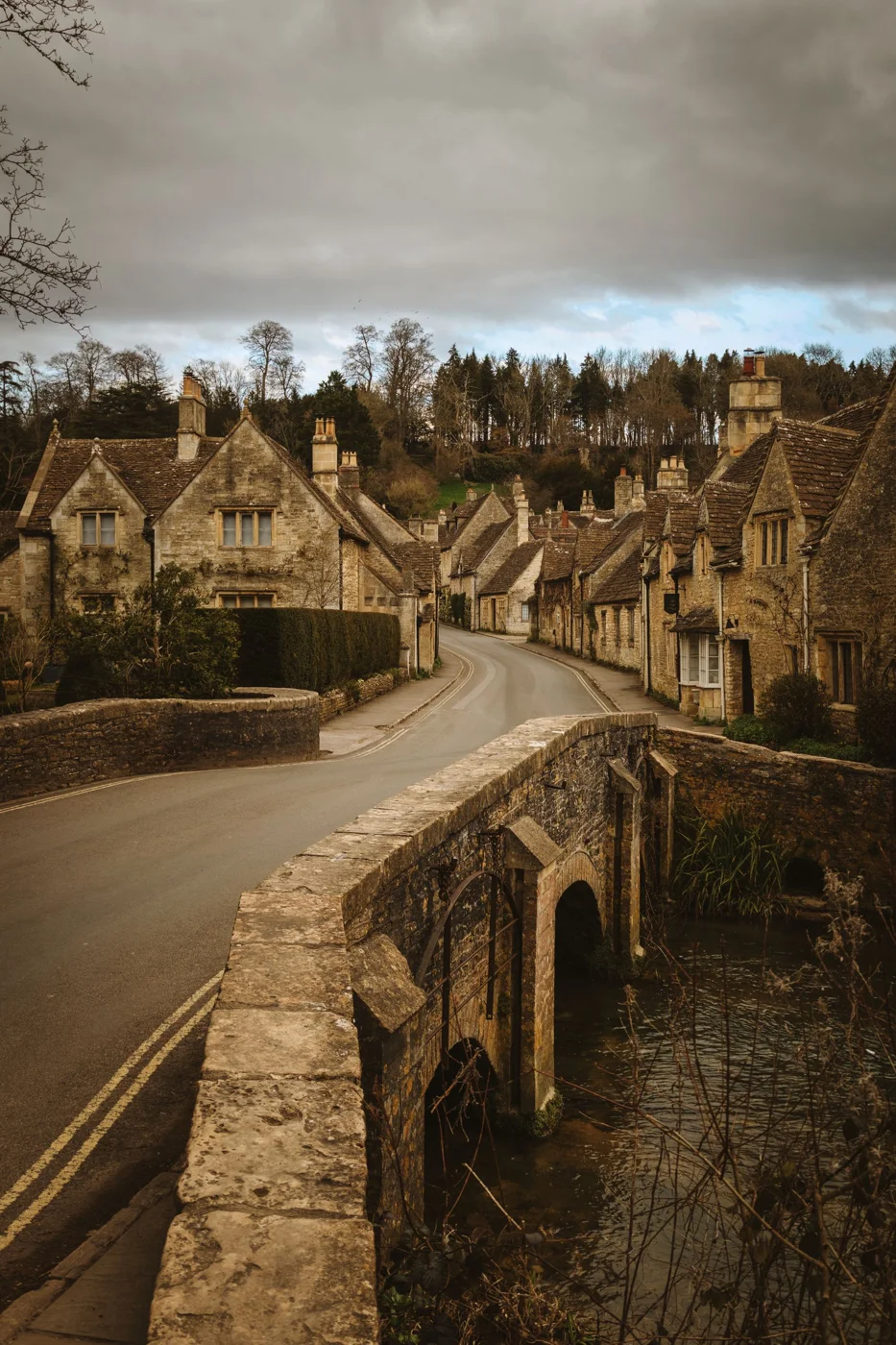 Traditional stone cottages and bridge in a Cotswolds village